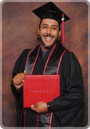 Erik Escareno holding his diploma