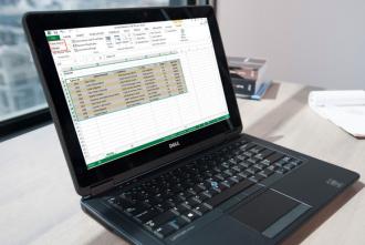 A laptop with Excel open. 