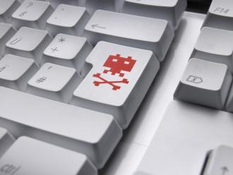 Keyboard with virus symbol. 