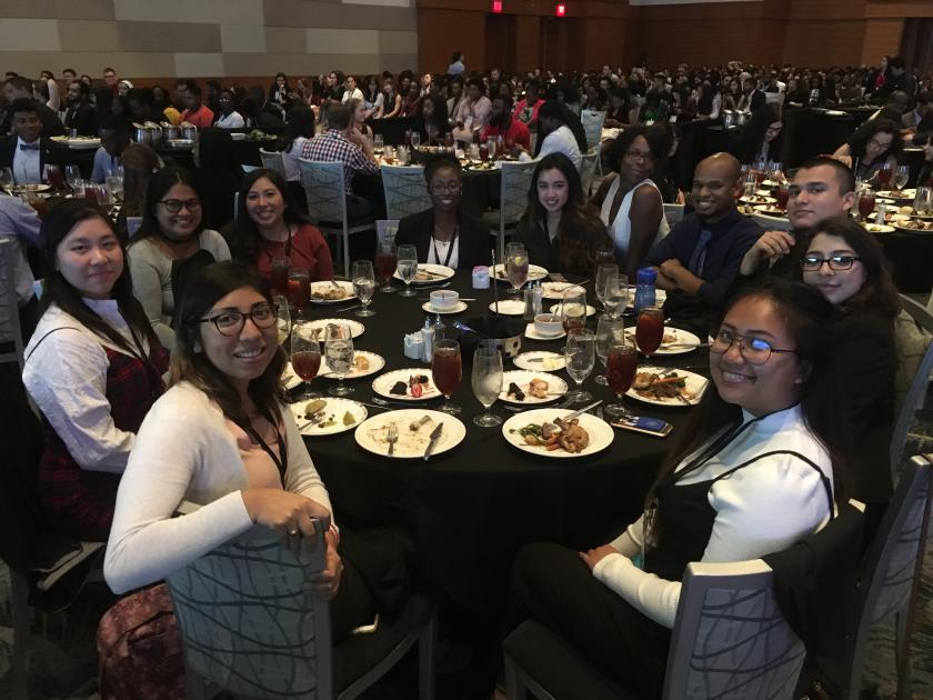 Students sit at table at ABRCMS conference