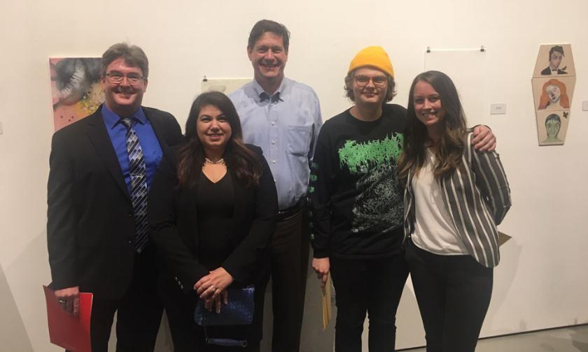 Dean Dan Hosken (left), Virginia Orndorff (left-center) and Chris Orndorff (center) presented the first round of scholarship winners with their awards at this year’s Annual Juried Student Art Exhibition. Oliver Mayhall (second to the left), was the first 