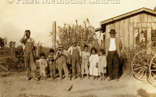 In front of dwelling, ca. 1910