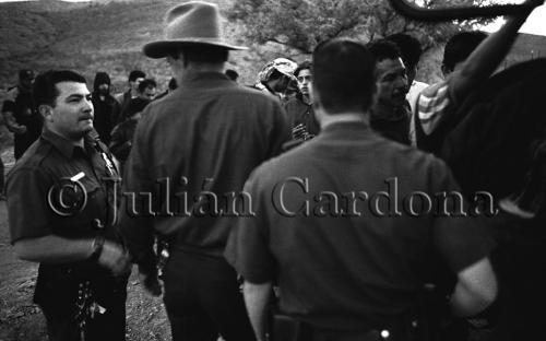 Border Patrol agents detain 80 illegal immigrants near Bisbee, Arizona. May 2000.