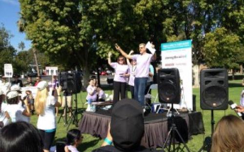 A man and woman giving a speech on stage