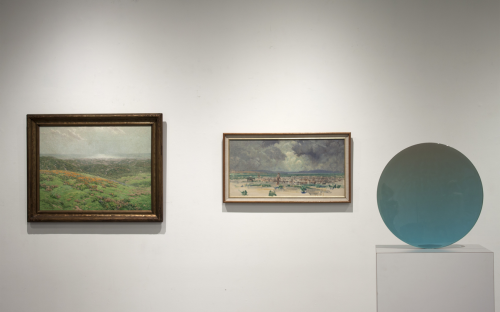 Install Image of the Main Gallery right wall as you enter.  Two oil landscape paintings and in the foreground there is a round resin sculpture by DeWain Valentine