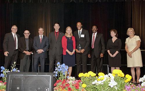 Franklin Ellis (Student Housing &amp; Conference Services) recipient of the 2015 Excellence in Diversity &amp; Inclusion Award with President Dianne F. Harrison and Cabinet.