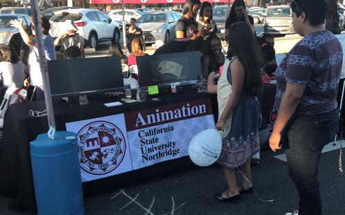 CSUN Animation Club, interacting with art walk attendees through a slide show