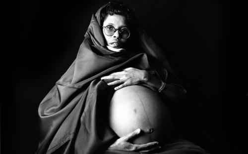 Young woman of French and Kenyan descent, carrying twins. Nairobi, 1994