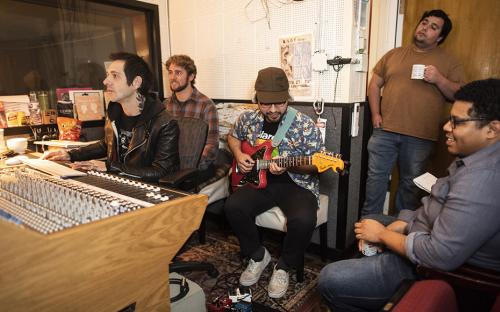 Nic Morreale and Julian Krisch from VOVE&#039;s Production Team working with a sound engineer, and two members of the band Tokyo Gold, saxophonist Tyler Johnson and guitarist Jon Aparicio in a local recording studio. Photo by Lee Choo.