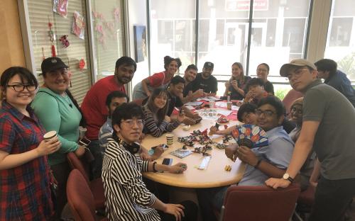 IESC Coffee Hour: Mid-autumn festival, students gathering around the table making Origami