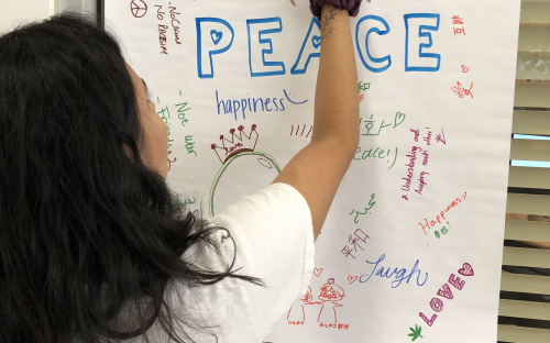 IESC Coffee Hour: International Day of Peace, students writing a peace message