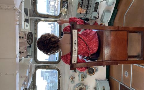 Sitting in the captain’s chair of the HMS Belfast – London, England
