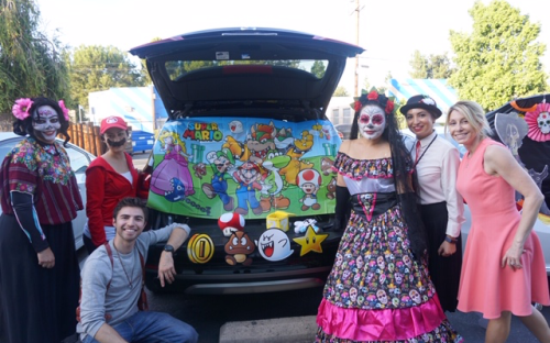 People in costume at Trunk or Treat