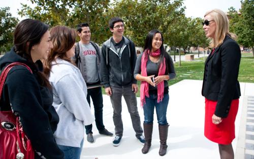 President Dianne F. Harrison interacts with students on her first official visit to CSUN.