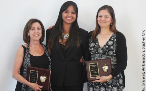 Family and Consumer Sciences Faculty and Acting Chair Terri Lisagor and Faculty and Marilyn Magaram Center Director Claudia Fajardo-Lira accept the Polished Apple Award from Rashi Bhatnager.