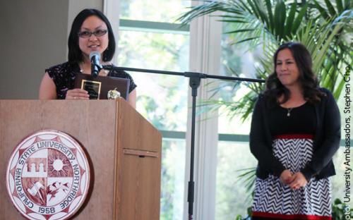 Child and Adolescent Development faculty Virginia Huynh receives the Polished Apple Award from Catherine Placencia