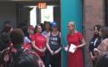 Crowd gathered around President Dianne Harrison in front of Santa Susana Hall.