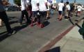 A group of men walking in high heels for domestic violence rally