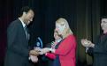 Franklin Ellis (Student Housing &amp; Conference Services) accepting the 2015 Excellence in Diversity and Inclusion Award from President Dianne F. Harrison.