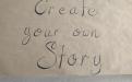 Brown poster paper with the words, “create your own story”