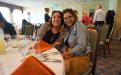 Two women smiling and posing for the photo