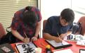 IESC Coffee Hour: Mid-autumn festival, students writing Asian Calligraphy