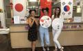 IESC Coffee Hour: Mid-autumn festival, students holding Asian handcraft paper umbrellas