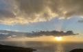 Ocean sunrise with a cloud of rain approaching – Hawaii 