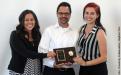 Child and Adolescent Development Faculty and Chair David Wakefield receives the Polished Apple Award from Catherine Placencia and Christine Matos.