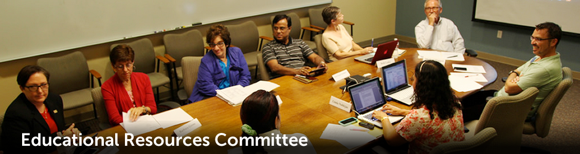 committee sitting around conference table