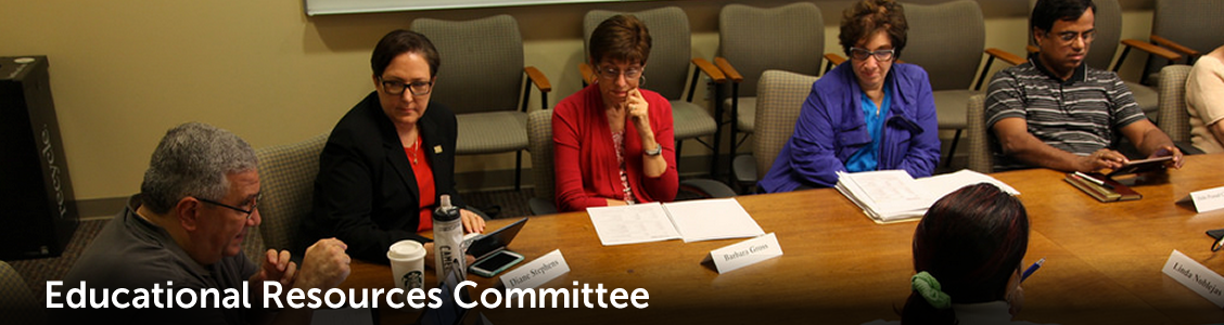 committee sitting around conference table