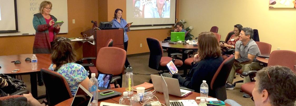 Faculty members attend an iPad workshop.