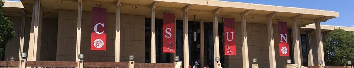 CSUN banners flying above the south portico of Oviatt Library.