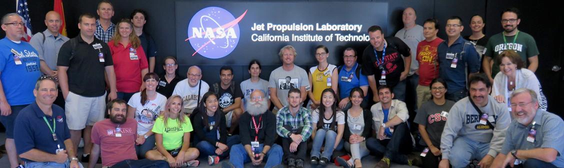 Science education students and personnel in front of a Jet Propulsion Laboratory, California Institute of Technology sign