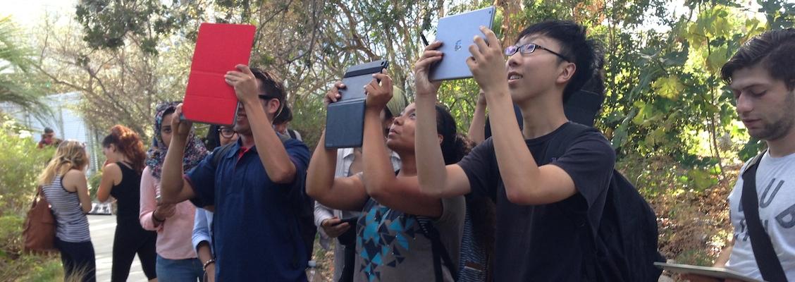 Biology students use iPad for outdoor activity.