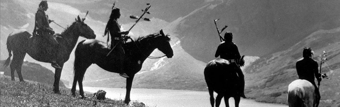 Native Americans on horseback.