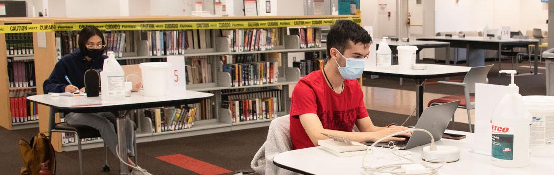 Masked Students studing in the Library