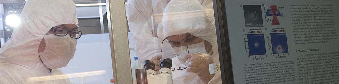 Researchers gowned in clean room