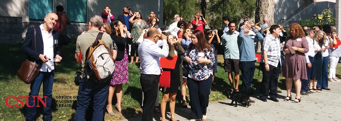 Retreat, conversing and looking at the eclipse