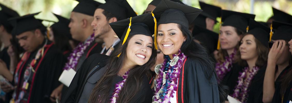 Two students at a graduation ceremony