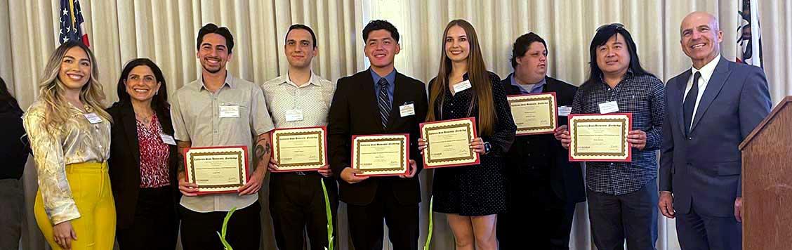 VITA student volunteers with awards.