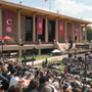 Wide shot of Commencement in front of the Oviatt Library