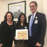 Jennifer Pemberton receives Dignity Health-Northridge Foundation award from Paul Watkins, Northridge Hospital President and Carol Stern, Northridge Hospital Board Chairman.