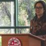 Edith Chen speaking at a podium