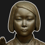 A bronze statue depicting an Oriental woman