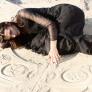 Woman laying on the beach