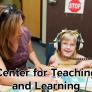 Special Education Teacher  from CSU Bakersfield sits with a Student