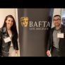 producer and director of AMAL standing next to BAFTA logo