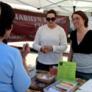 student dietitians share nutrition tips with community members at a farmers market
