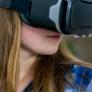 A woman using a virtual reality headset. 